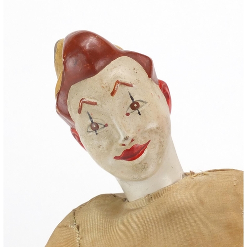 350 - Two vintage clown dolls with pottery heads and cloth bodies, 25cm high