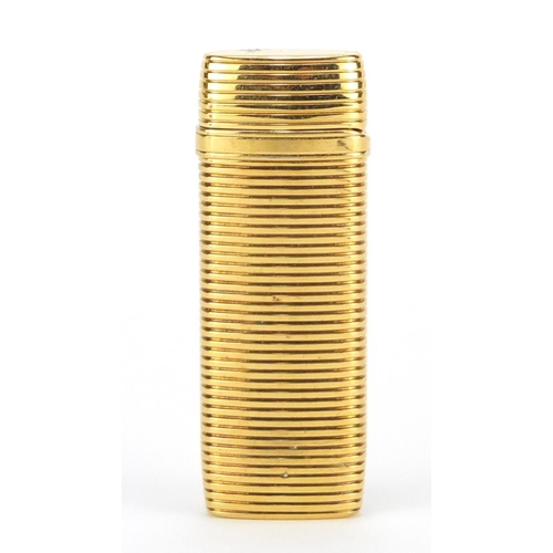 722 - Yves Saint Laurent gold plated pocket lighter, 7.2cm high