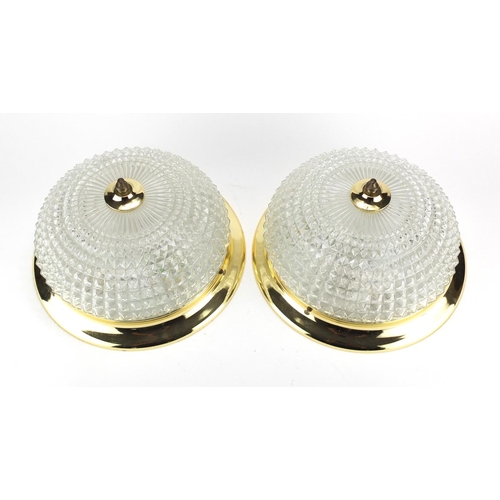 139 - Pair of circular glass and brass light fittings, 29.5cm in diameter