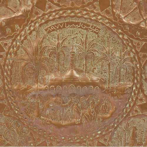 75 - Large Middle Eastern copper tray embossed with camels, figures, horses and boats, engraved Fauzi Naa... 