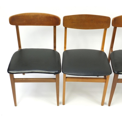 4 - Set of eight vintage teak chairs with black leatherette seats, in the style of Kofod Larsen, 76cm hi... 