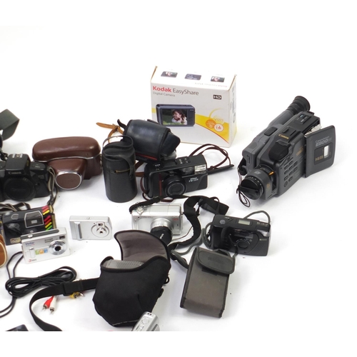 398 - Vintage and later cameras, camcorders, lenses and accessories including Canon EOS500, Praktica, Koda... 