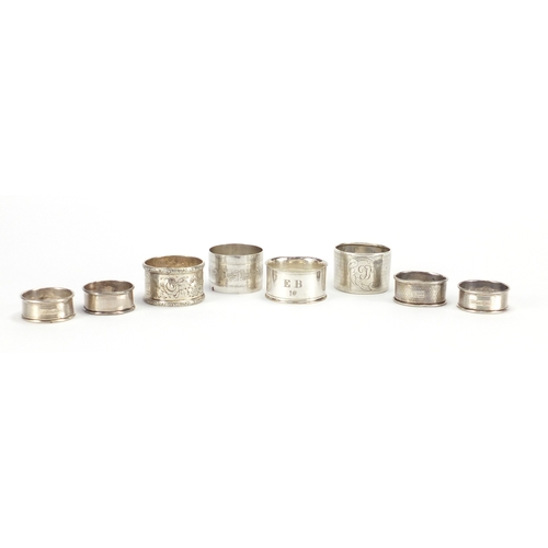 2604 - Eight circular silver and white metal napkin rings, various hallmarks, 178.0g