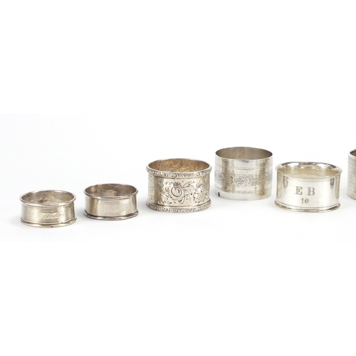2604 - Eight circular silver and white metal napkin rings, various hallmarks, 178.0g