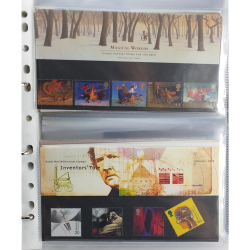 2554 - Royal Mint presentation packs arranged in an album, various denominations and genres