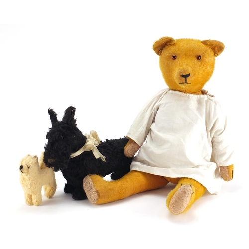 169 - Vintage toys including a golden straw filled bear and a Steiff dog, the largest 61cm in length