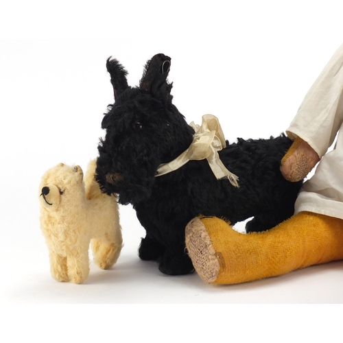 169 - Vintage toys including a golden straw filled bear and a Steiff dog, the largest 61cm in length