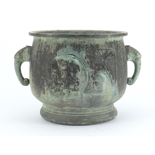 461 - Chinese archaic style patinated bronze planter with elephant head handles, cast with panels of birds... 