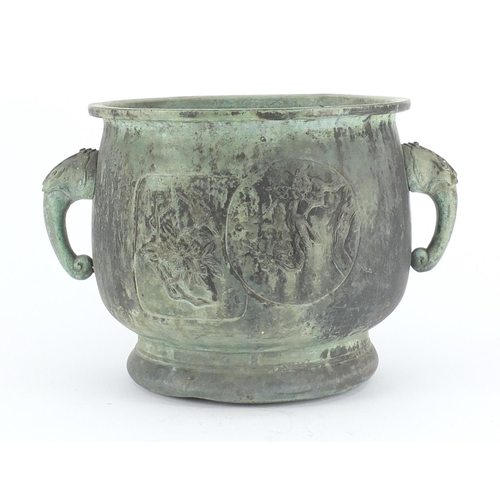 461 - Chinese archaic style patinated bronze planter with elephant head handles, cast with panels of birds... 