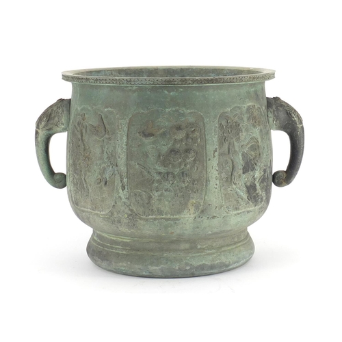 462 - Chinese archaic style patinated bronze planter with elephant head handles, cast with panels of birds... 