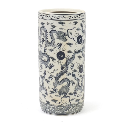 300 - Chinese blue and white porcelain stick stand, decorated with dragons amongst clouds, 47cm high