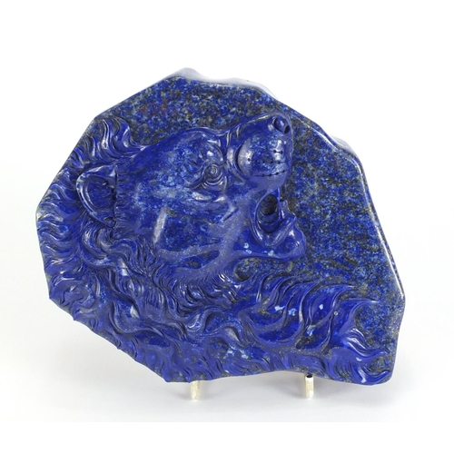 754 - Large Chinese lapis lazuli panel carved with a lions head, housed in a fitted box, the panel 20cm x ... 