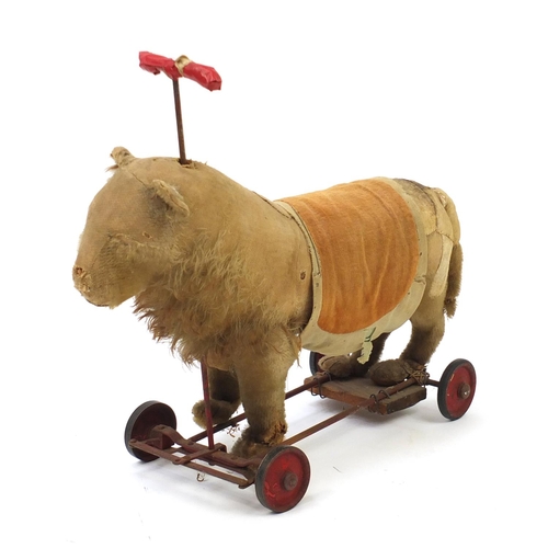 59 - Antique Steiff stuffed ride on lion with growler, 54cm in length