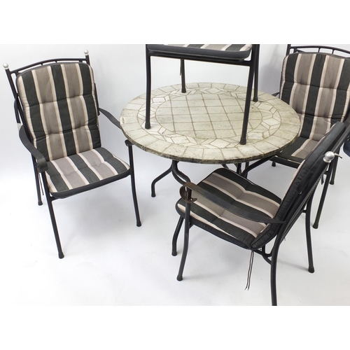 79 - Stone mosaic garden table with four chairs, the table with Sun Garden label, 74cm high x 100cm in di... 