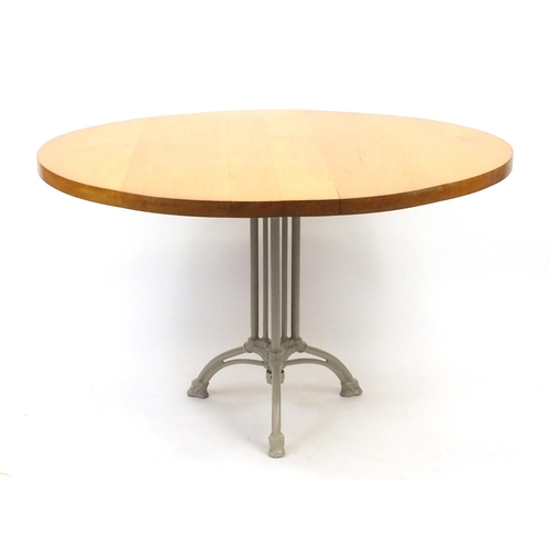 77 - Circular maple dining table, with cast iron base, 76cm high x 120cm in diameter
