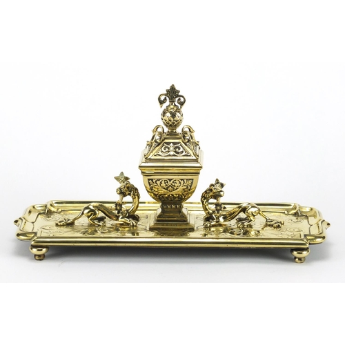 170 - Gilt brass dragon design desk stand with inkwell and glass liner, 33.5cm wide