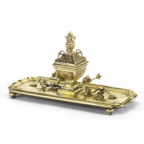 170 - Gilt brass dragon design desk stand with inkwell and glass liner, 33.5cm wide