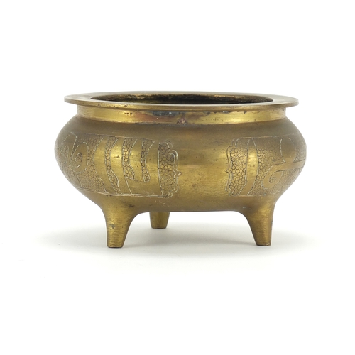 266 - Chinese bronze tripod incense burner, character marks to the base, 8.5cm high x 14.5cm in diameter