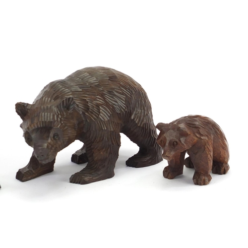 160 - Three carved Black Forest bears, the largest 20cm in length