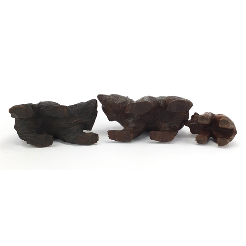 160 - Three carved Black Forest bears, the largest 20cm in length