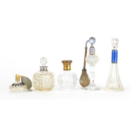688 - Five Victorian and later cut glass scent bottles, two with silver collars