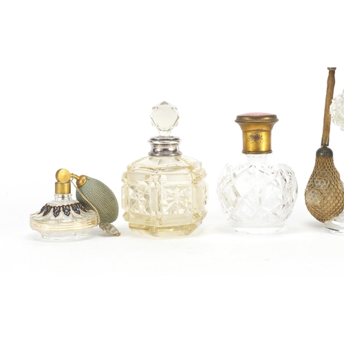 688 - Five Victorian and later cut glass scent bottles, two with silver collars