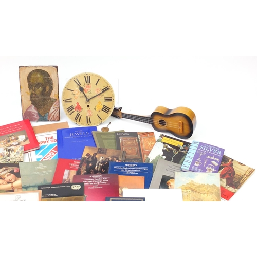 539 - Sundry items comprising auction catalogues, a long case clock movement, child sized guitar and pictu... 