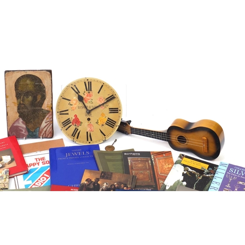 539 - Sundry items comprising auction catalogues, a long case clock movement, child sized guitar and pictu... 