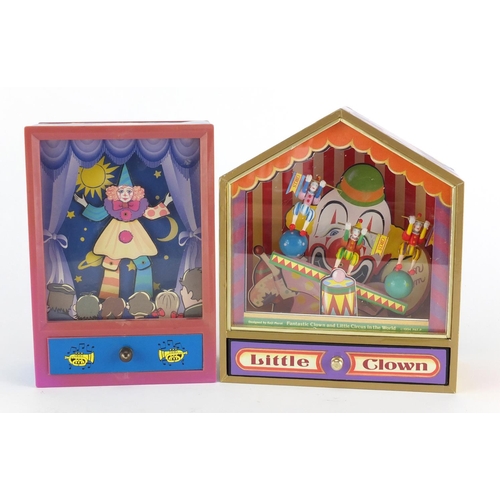 125 - Two musical clown diorama's, the largest 20.5cm high