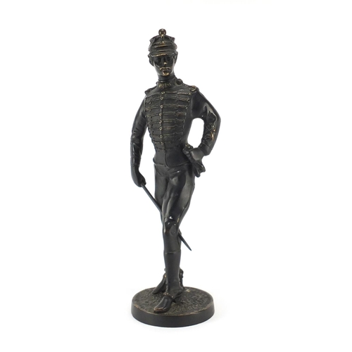 118 - Large bronze figure of a soldier holding a swagger stick, 37.5cm high
