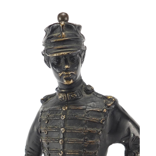 118 - Large bronze figure of a soldier holding a swagger stick, 37.5cm high