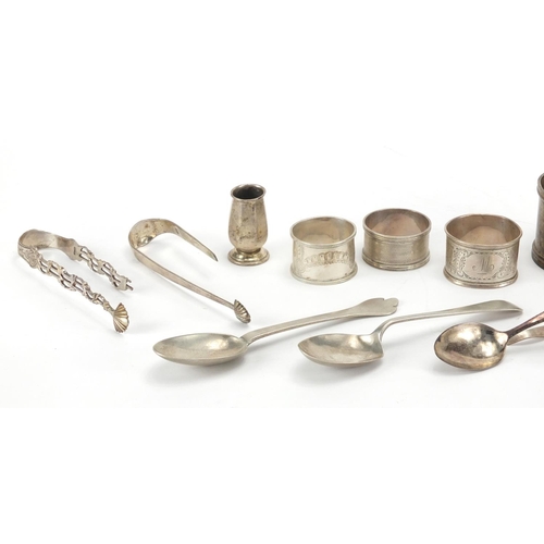 680 - Silver objects including napkin rings, teaspoons and sugar tongs, various hallmarks, 389.0g