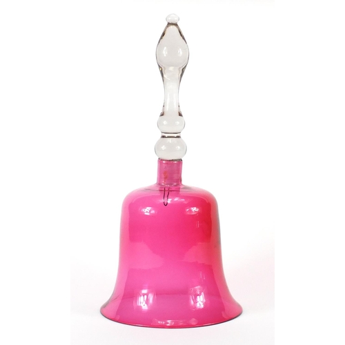 121 - Victorian cranberry glass bell, 34cm high