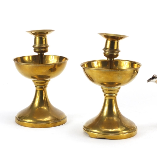 129 - Pair of antique brass candlesticks with drip trays and a silver plated teapot, the candlesticks 20cm... 