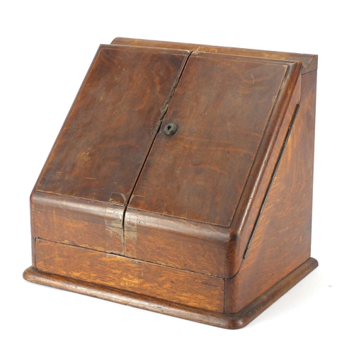 475 - Oak slope front stationery box with fitted interior and calendar, 31.5cm H x 34.5cm W x 25cm D