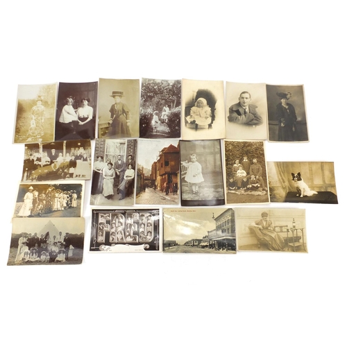 802 - Mostly black and white photographic social history postcards including Uckfield Carnival
