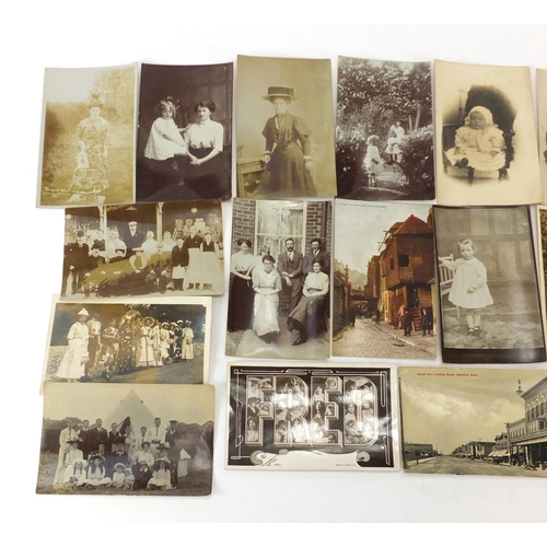 802 - Mostly black and white photographic social history postcards including Uckfield Carnival