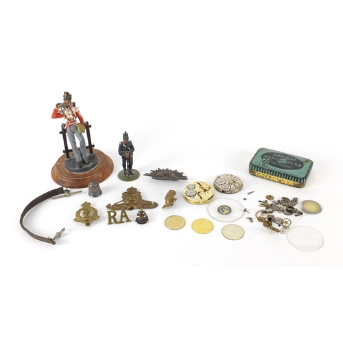 757 - Miscellaneous objects including two hand painted Military figures, Military cap badges, silver pocke... 