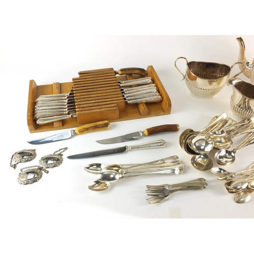 472 - Silver plated including a demi fluted three pieces tea service and Asprey knifes, some with silver h... 