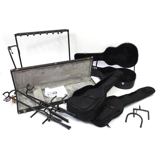 105 - Nine guitar stands and cases