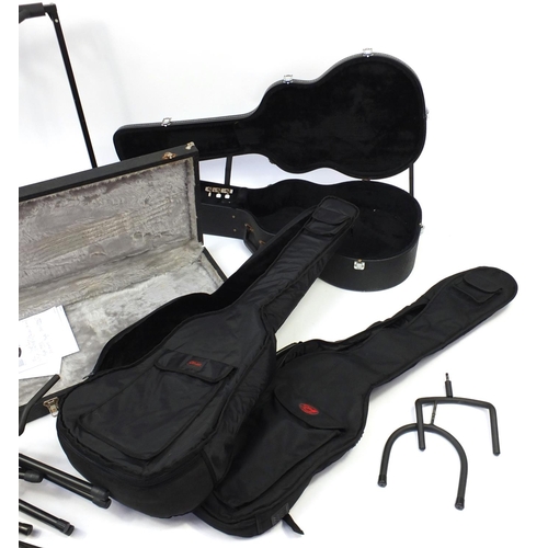 105 - Nine guitar stands and cases
