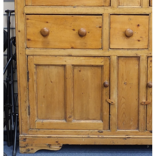 14 - Victorian pine side cabinet with a pair of glazed doors above three drawers and a pair of cupboard d... 