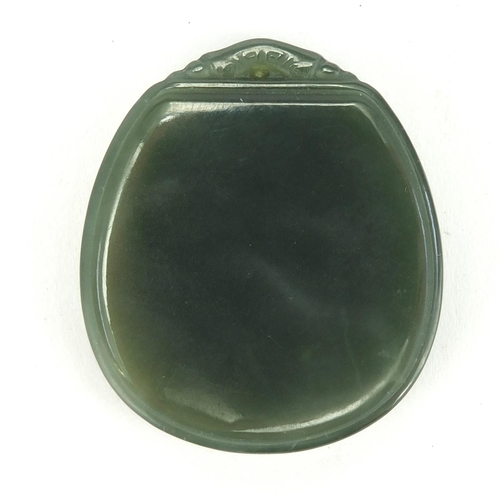 702 - Chinese green jade pendant. 4.7cm in length