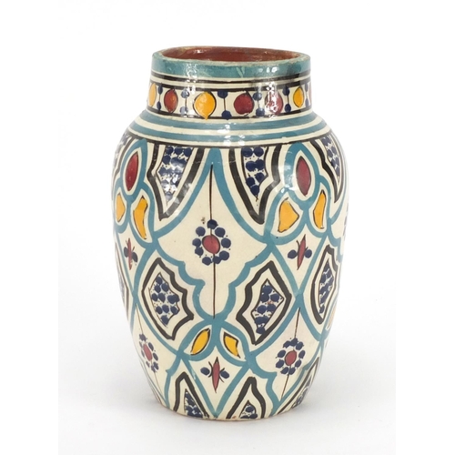 350A - Middle Eastern Iznik pottery design vase, hand painted with flower, 21cm high