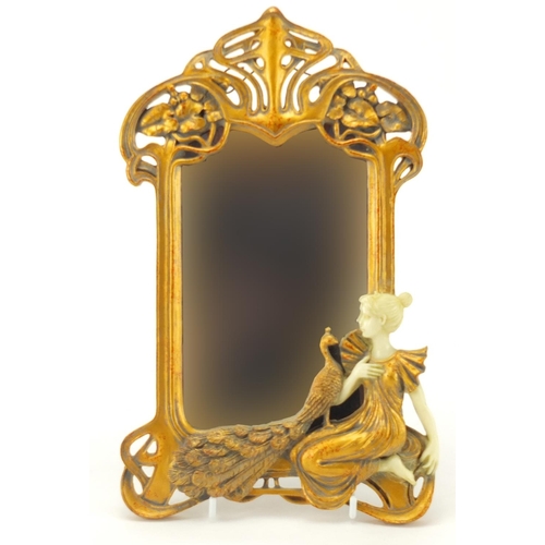 108 - Art Nouveau style wall hanging mirror, decorated with a maiden and a peacock, 30cm high