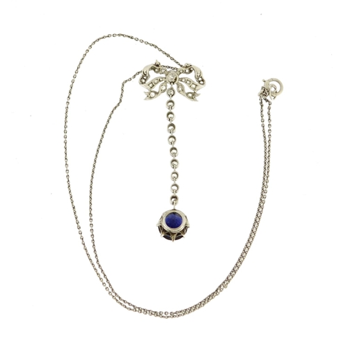 835 - Unmarked white metal sapphire and diamond bow necklace, tests as 18ct gold, the pendant 4.5cm long, ... 