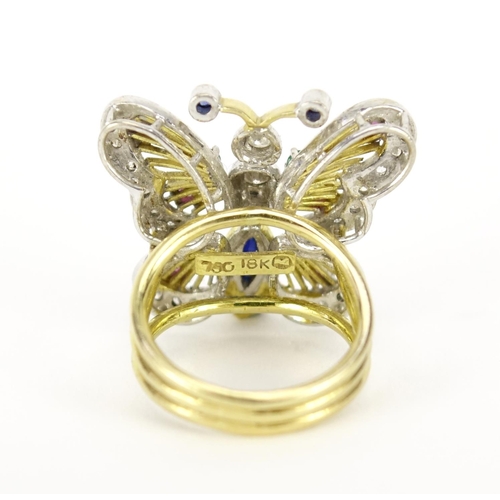 836 - Continental 18K gold butterfly ring set with diamonds, sapphires, rubies and emeralds, impressed mak... 