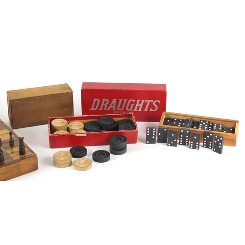 255 - Vintage wooden games including chess, draughts and dominoes with a folding games box