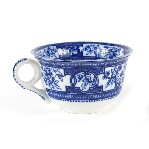 91 - Victorian blue and white porcelain over sized cup and saucer, the saucer 22cm in diameter