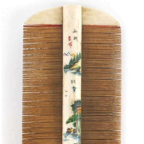 481 - Chinese part stained bone and bamboo comb carved with a landscape and calligraphy, 10.5cm wide